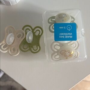 MAM Baby Pacifiers - Green and Cream one is new, other removed from box
